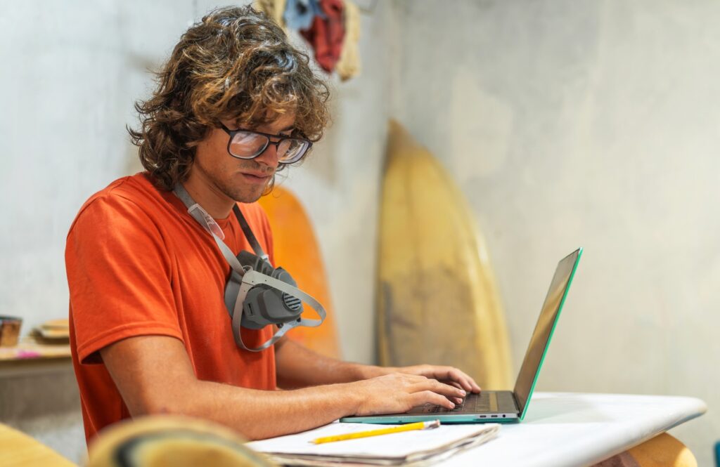Craftsman man working on his laptop